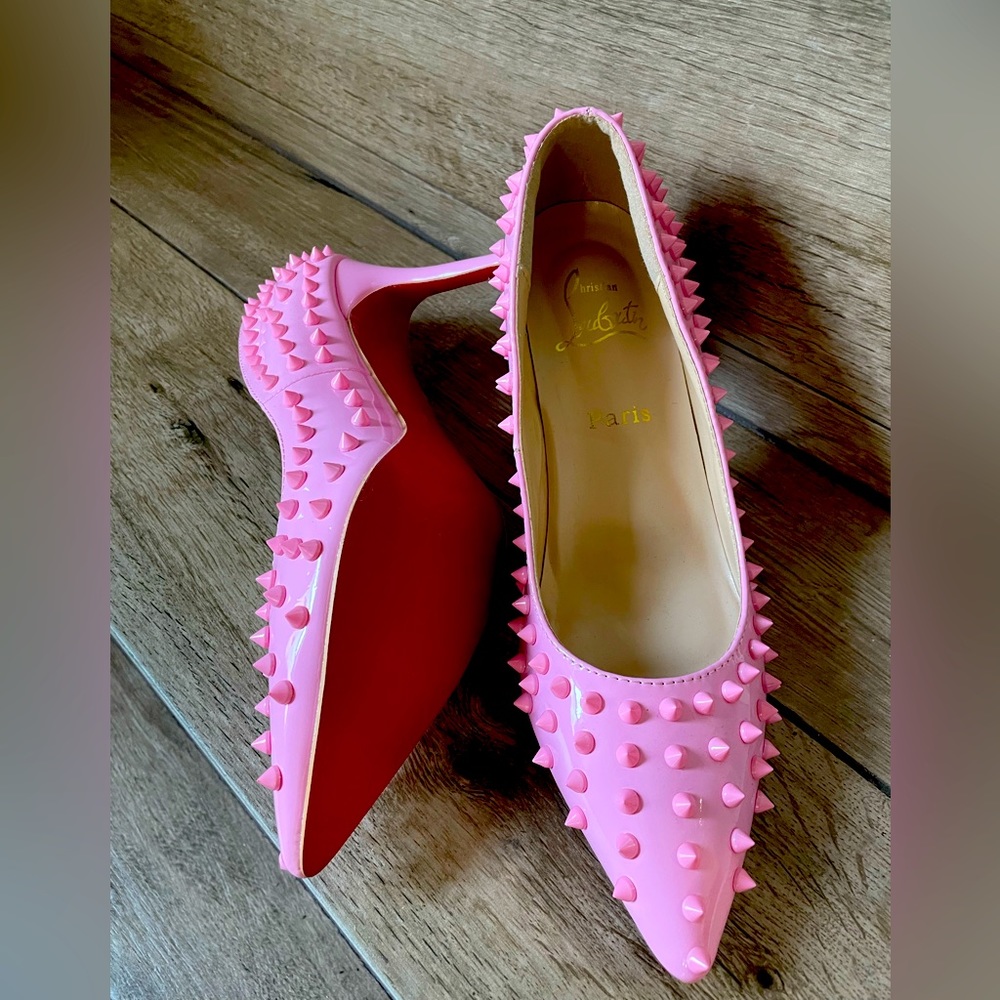Pink studded high heel red bottoms